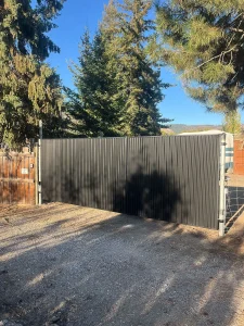 Black corrugated metal fence Vernon BC North Okanagan