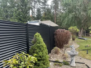 Corrugated metal fencing backyard Okanagan BC
